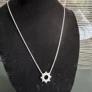 Elegant Silver Necklace with Sunburst Pendant